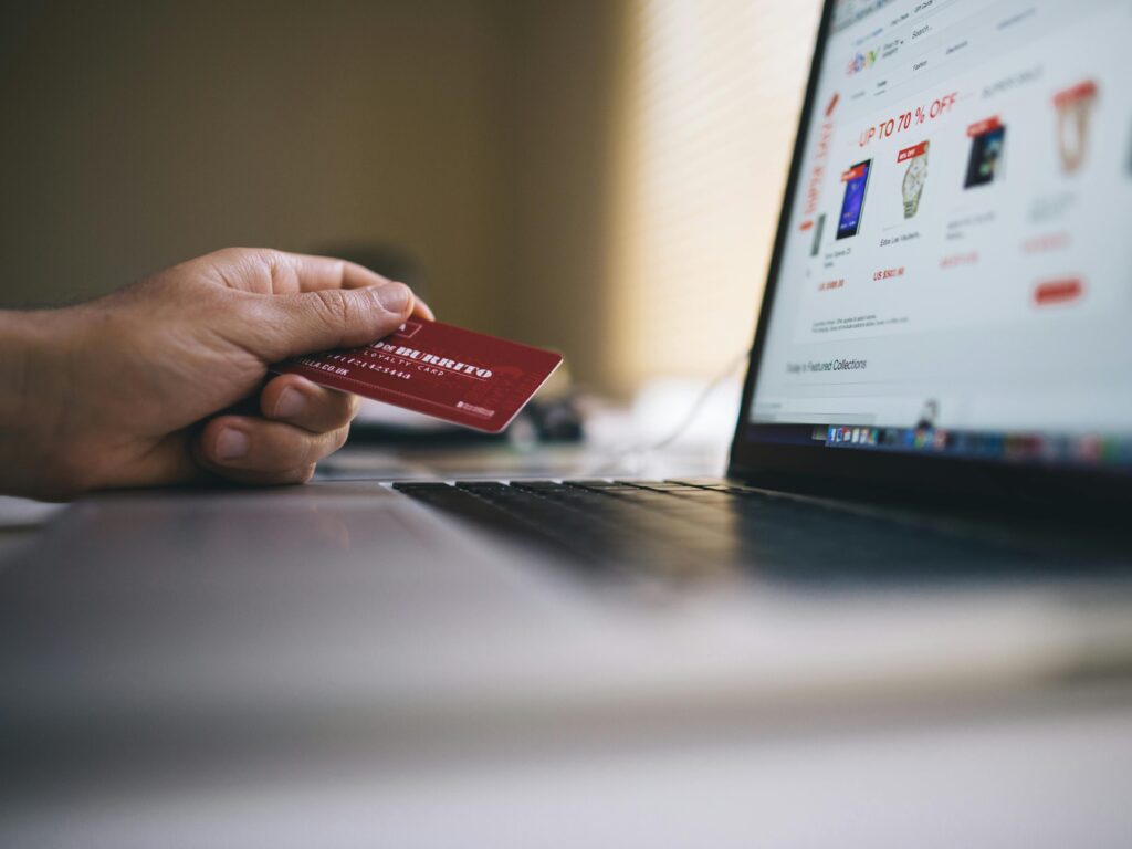 Person using credit card to pay online